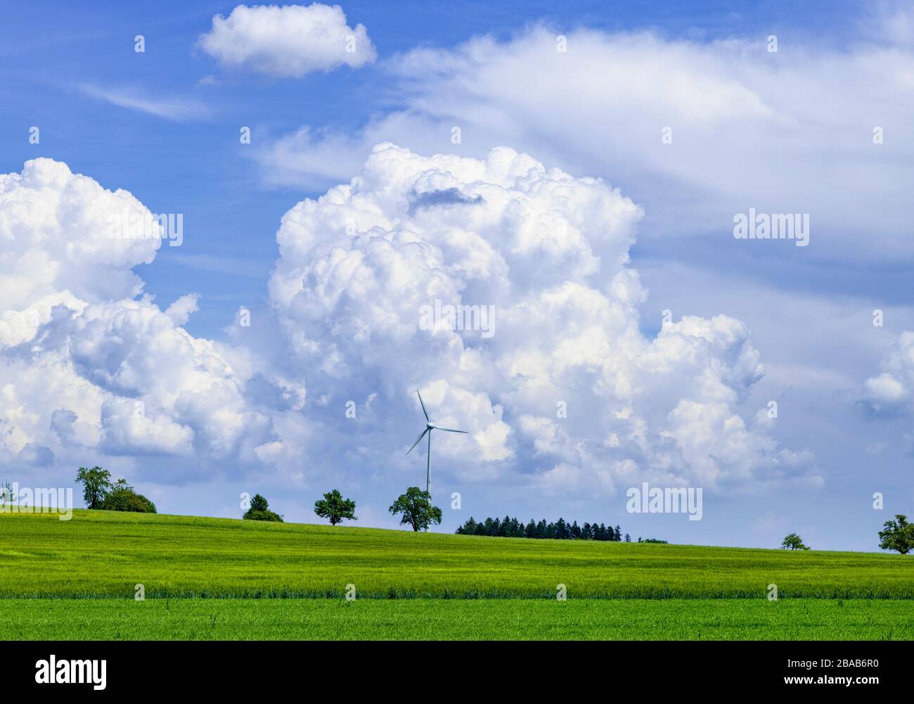 Wind turbine with cumulus cloud, Baden Wurttemberg, Germany Stock Photo