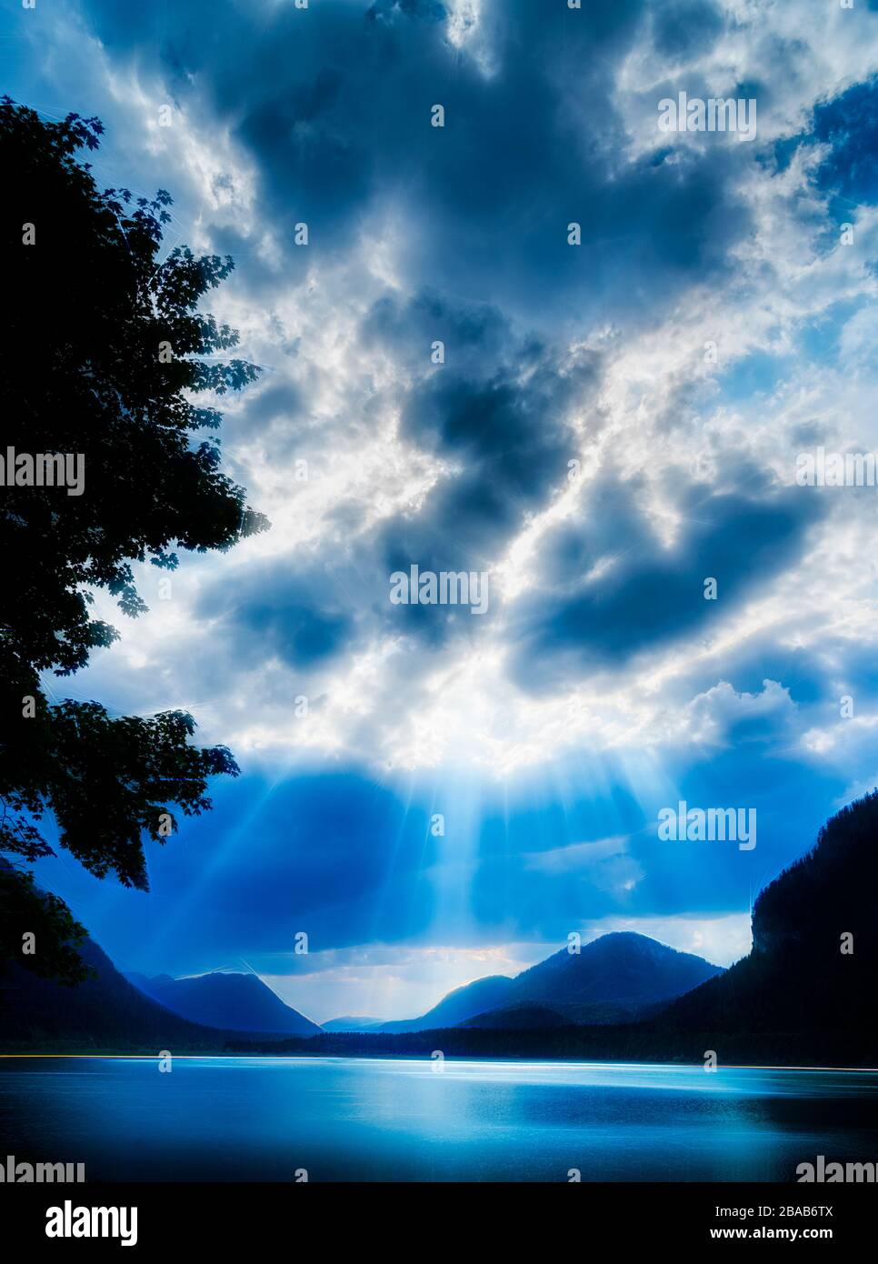 God rays over Sylvenstein lake, Bavaria, Germany Stock Photo