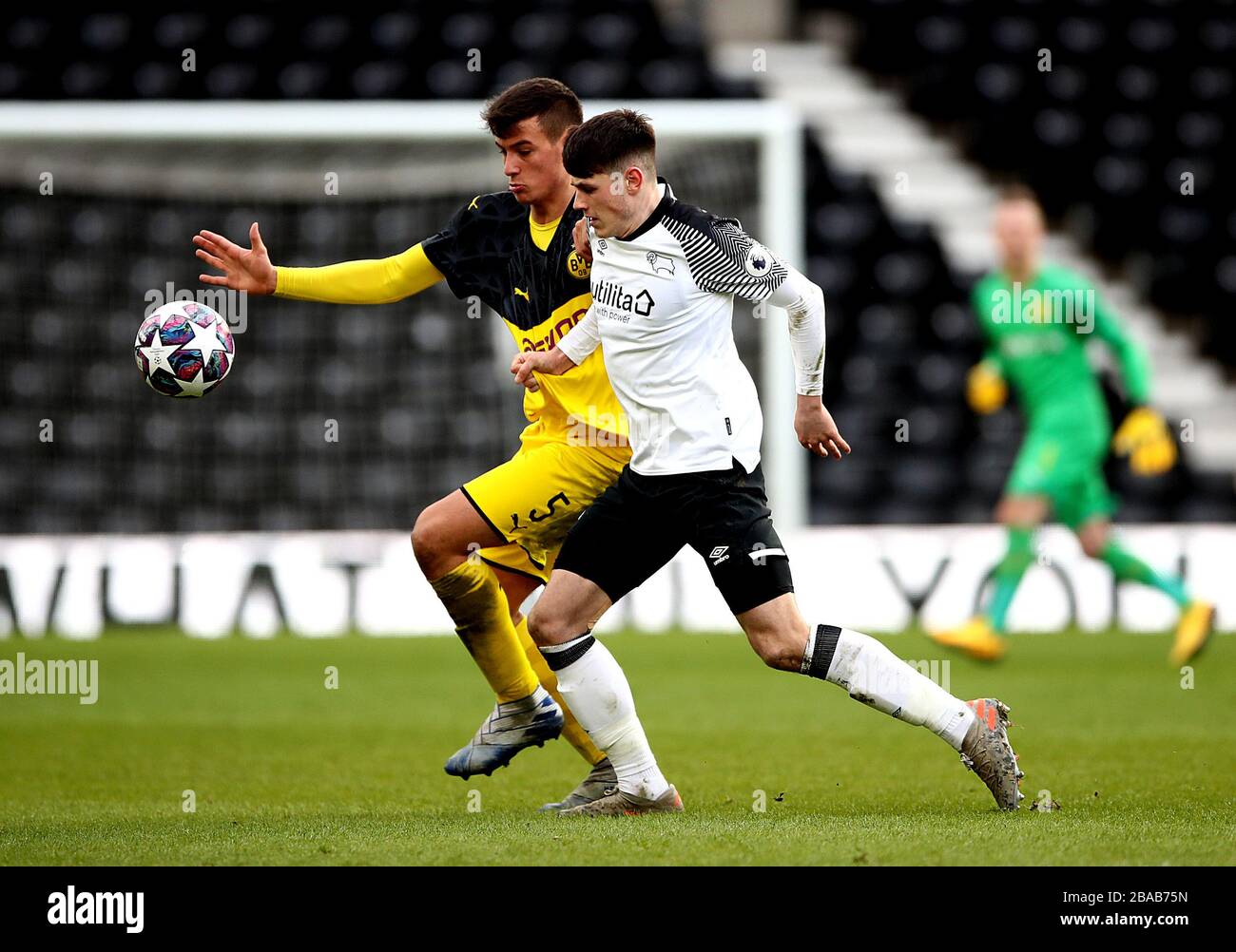 Derby County's Jack Stretton (right) and Borussia Dortmund's Ramzi Ferjani (left) battle for the ball Stock Photo