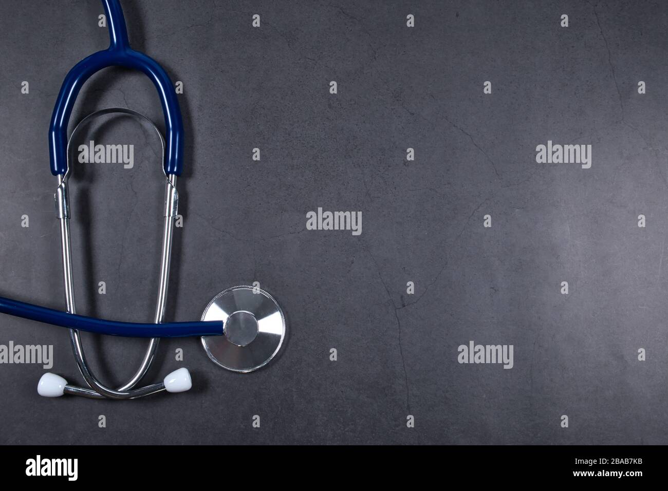 Doctor's stethoscope on black table, stethoscope concept photo with copy space empty area for text Stock Photo