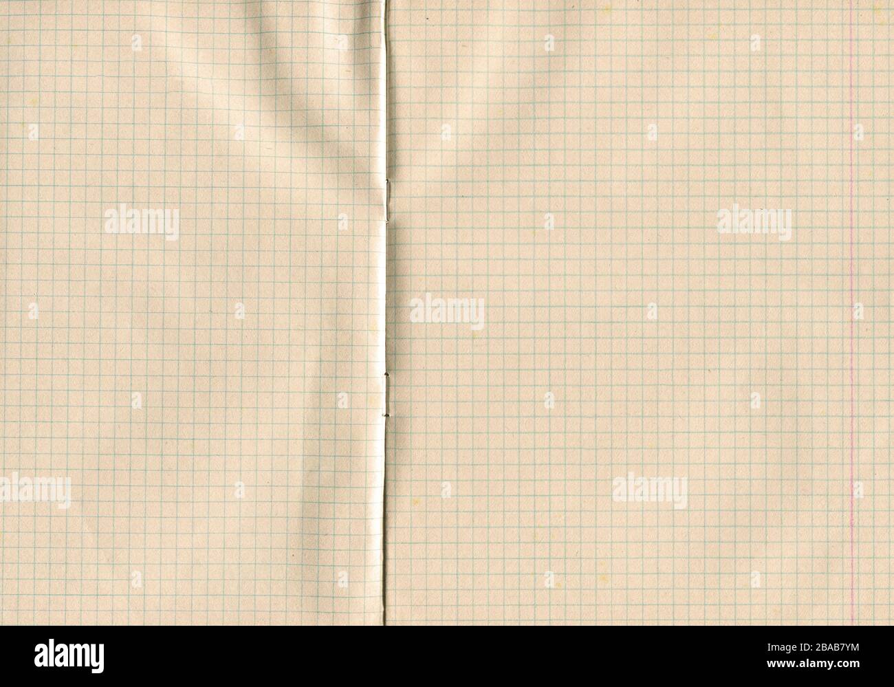 Grid old paper. Graph paper notebook. Texture of vintage paper. Aging