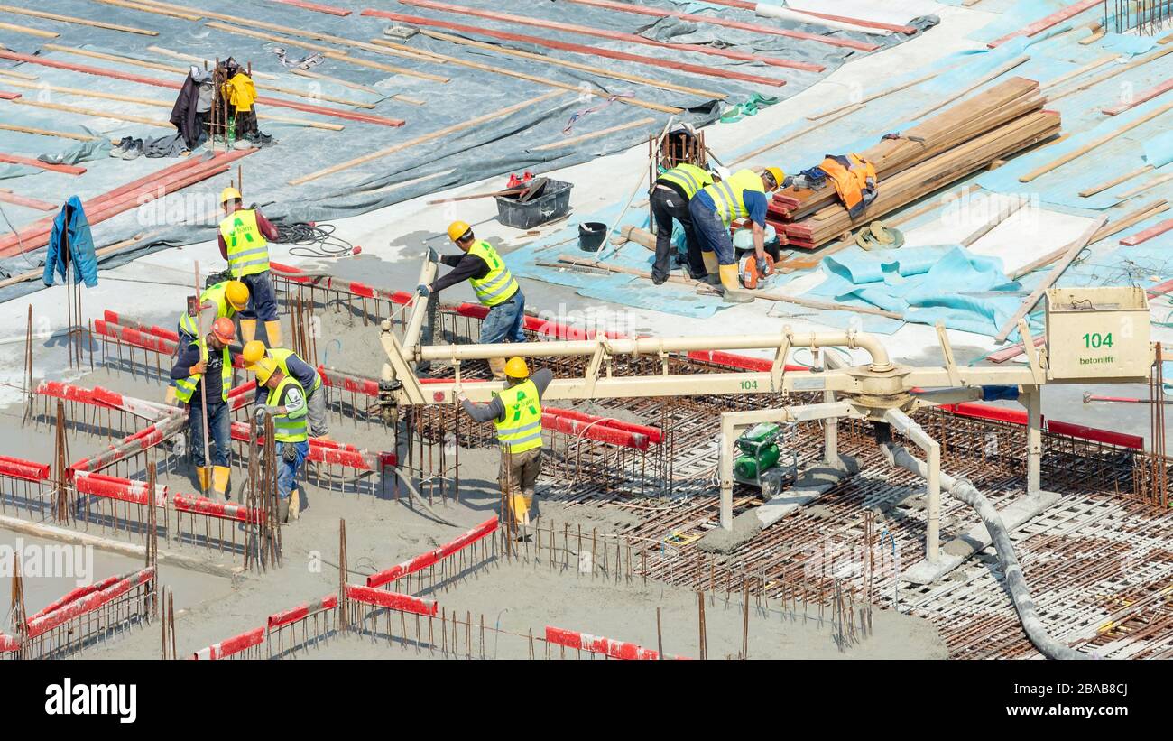 Hamburg, Germany; 20th May 2019; Group of Construction Workers at Work on a Large Construction Site Stock Photo
