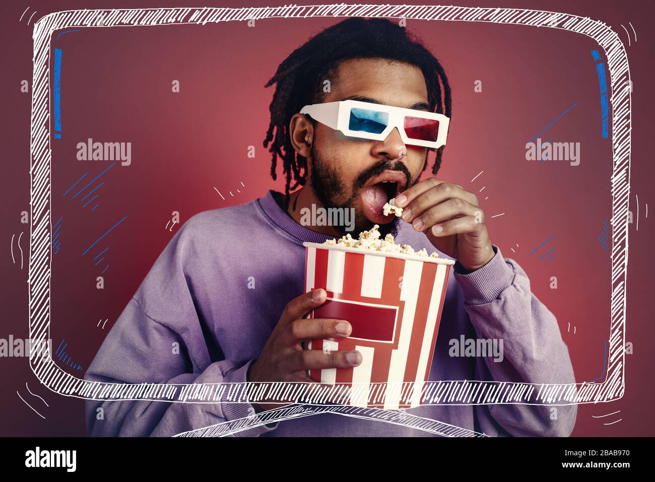 Boy has fun watching a film. Concept of entertainment and streaming tv. red background Stock Photo