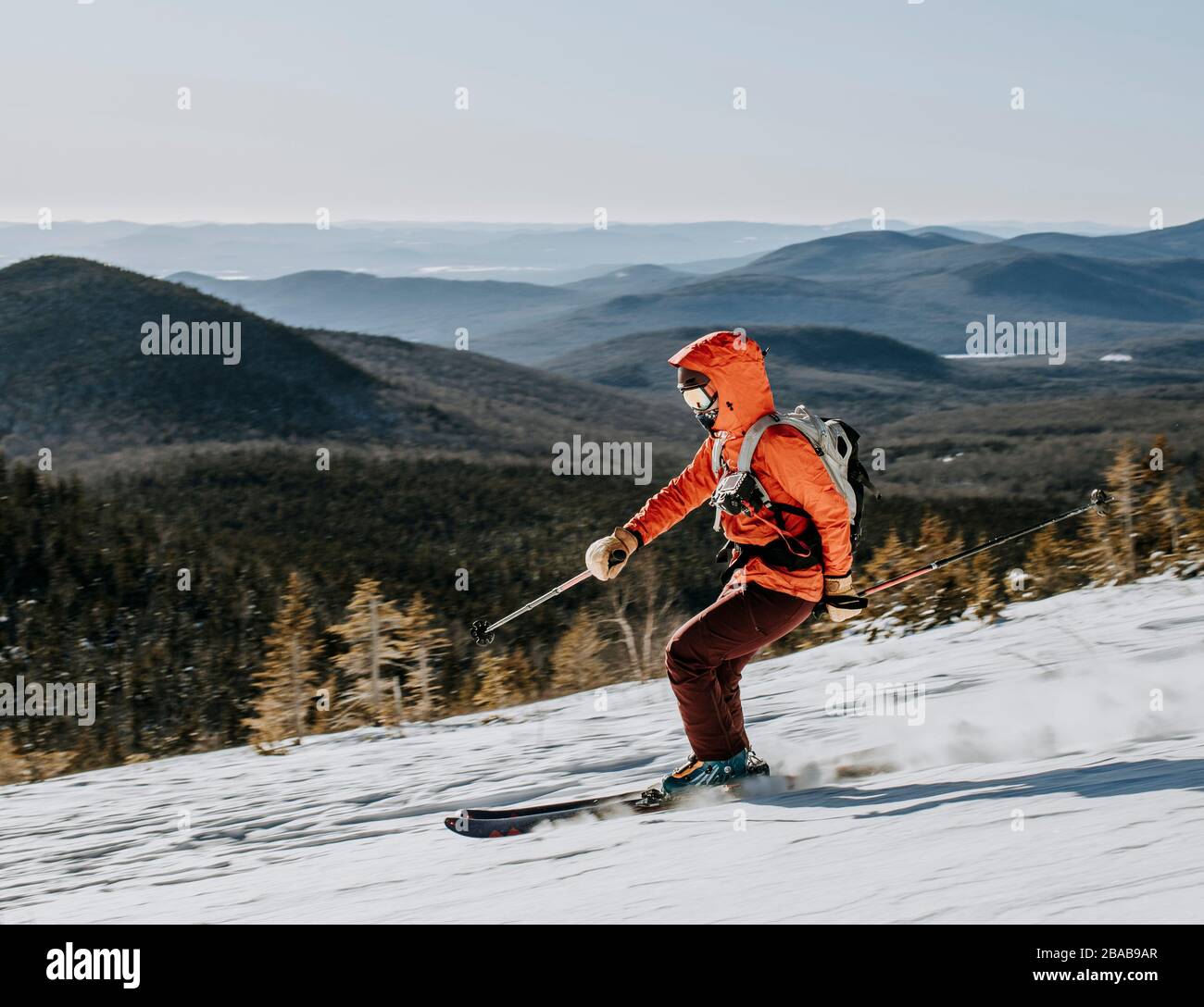 Skier speeds down slope on Baldface Mountain, New Hampshire Stock Photo