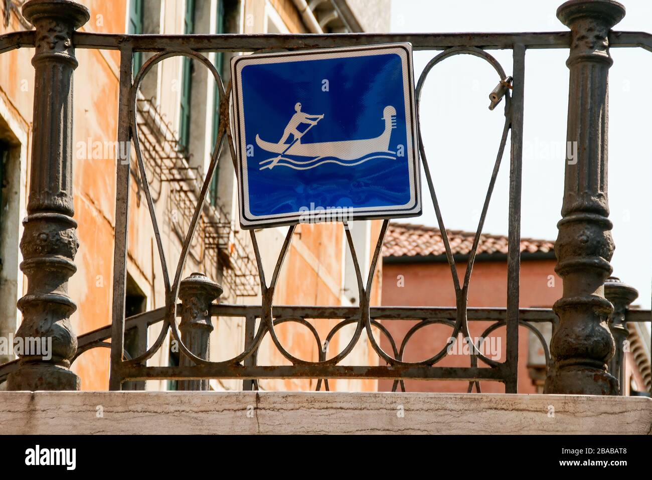 A sign on a bridge over a side canal indicating that the canal is open for gondola traffic. Venice, Italy. Stock Photo