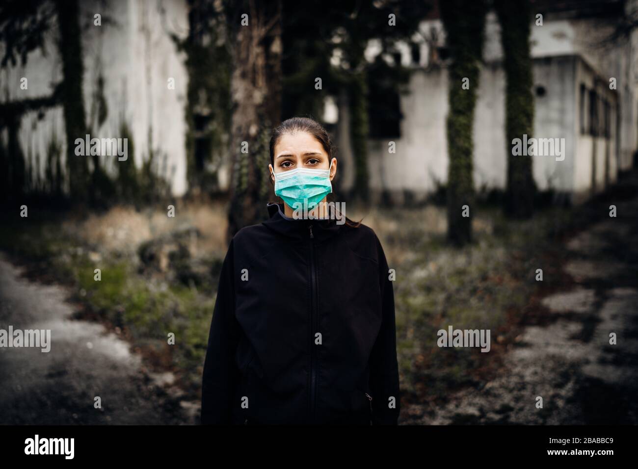 Patient suffering from infectious disease,sick person in mask.Scared woman having symptoms of incurable contagious illness.Patient in isolation.Infect Stock Photo