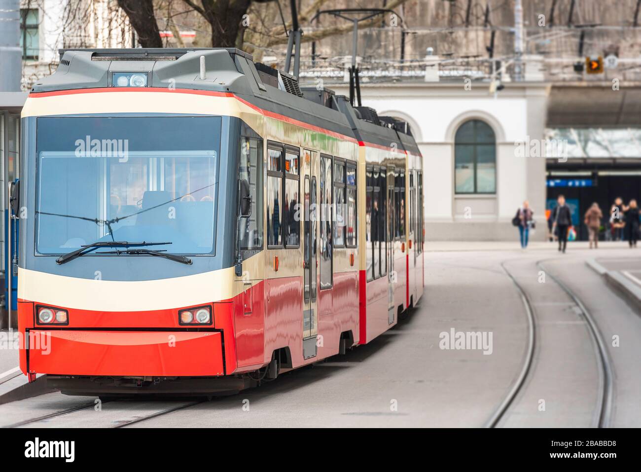 Zurich urban scenery with a tram on an empty street. Ecofriendly