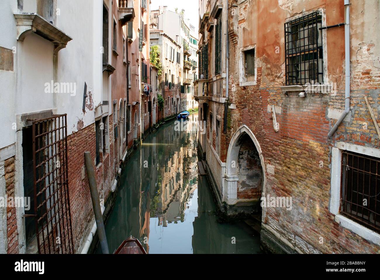 Silent and empty small side canal in Venice, Italy. No People Stock Photo