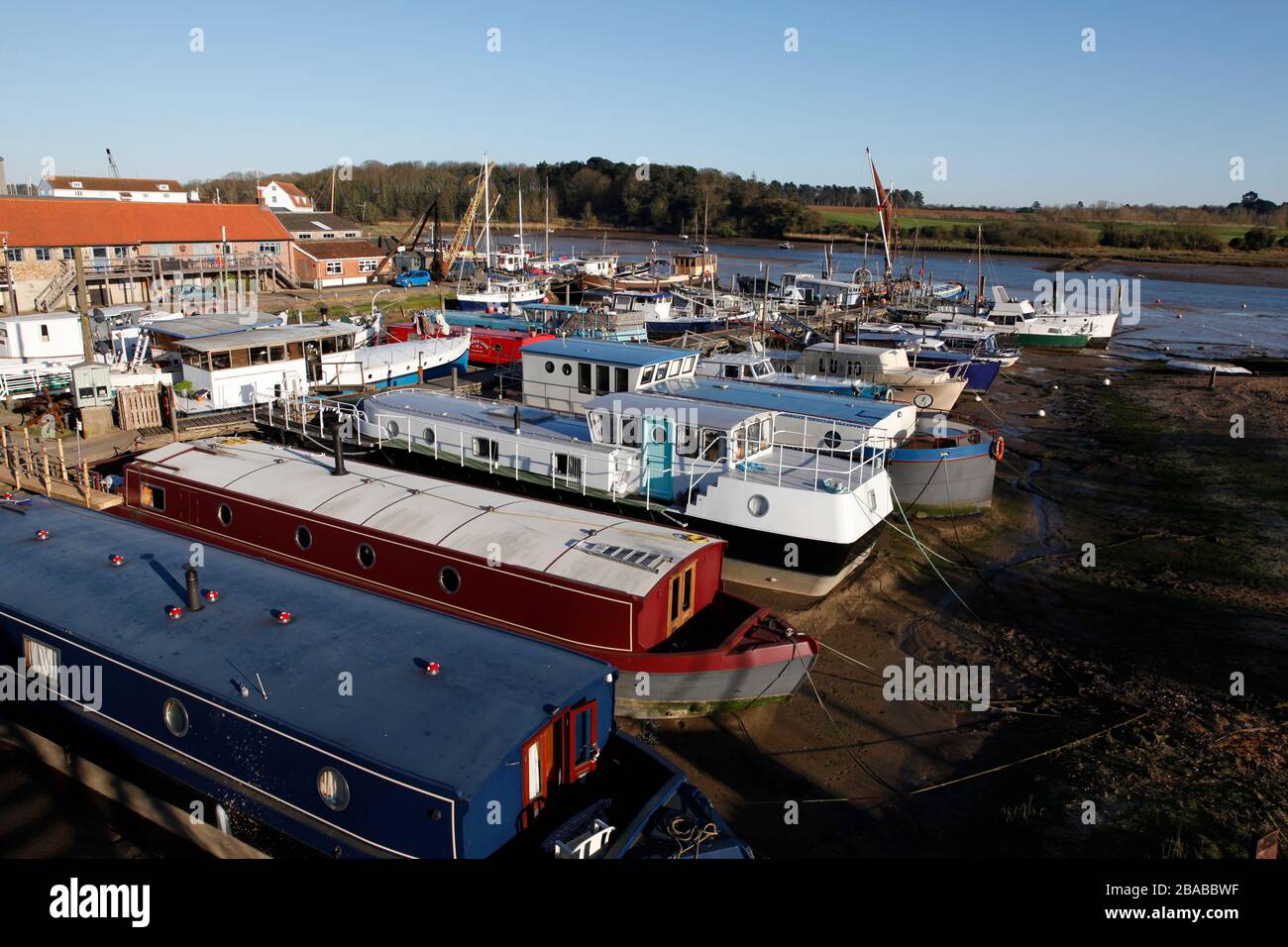 Barges and a variety of live aboard houseboats moored at The Ferry Quay