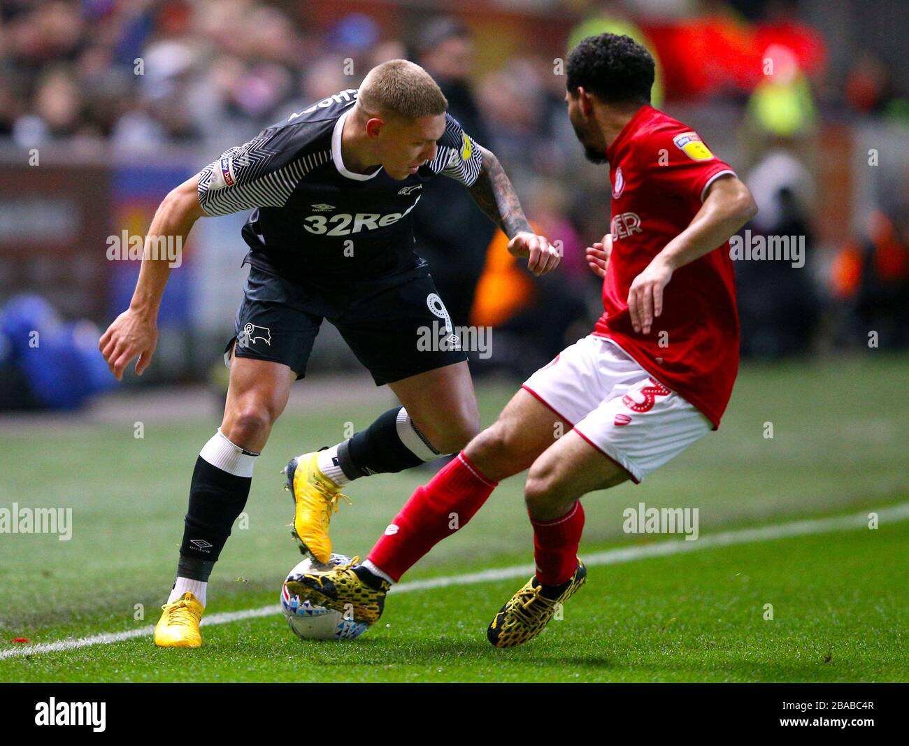 Bristol City's Jay Dasilva (right) and Derby County's Martyn Waghorn battle for the ball Stock Photo