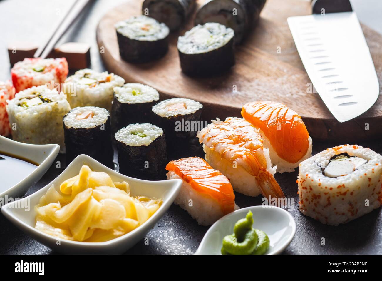 Japanese sushi food. Maki, nigiri and california roll sushi with salmon, caviar, avocado, tuna and wasabi with ginger. Stock Photo