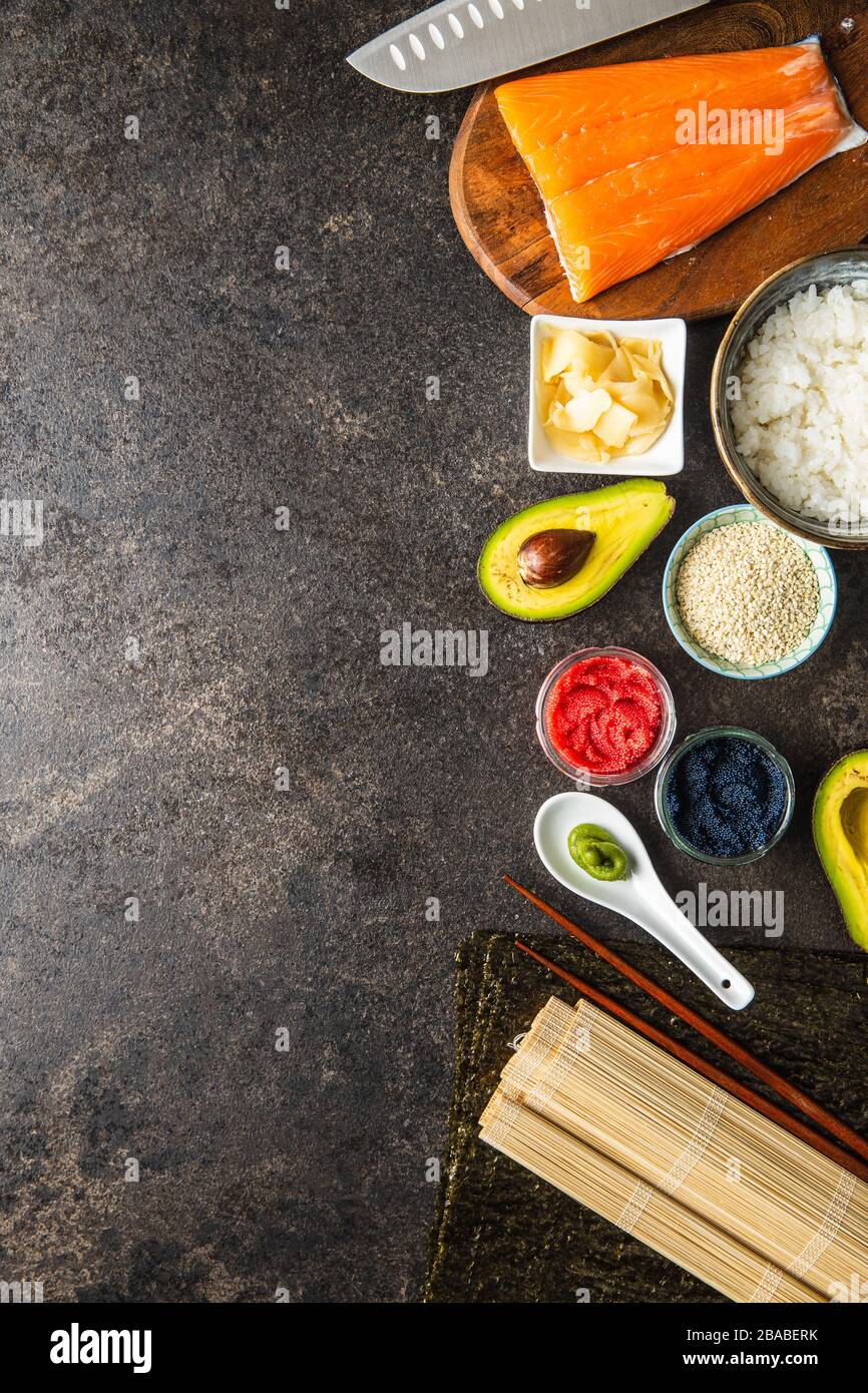 Ingredients for the preparation of sushi rolls. Production of fresh maki and nigiri sushi. Top view. Stock Photo