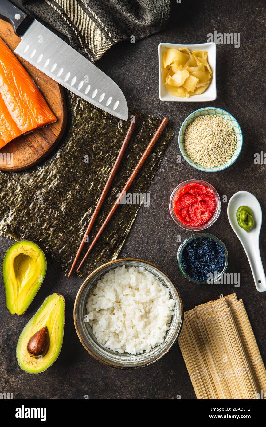 Ingredients for the preparation of sushi rolls. Production of fresh maki and nigiri sushi. Top view. Stock Photo