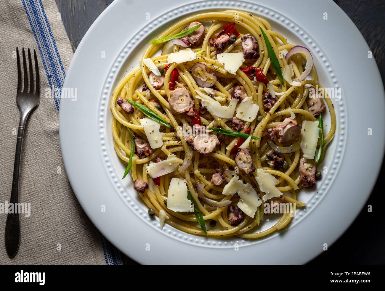 Bucatini pasta with octopus Stock Photo - Alamy