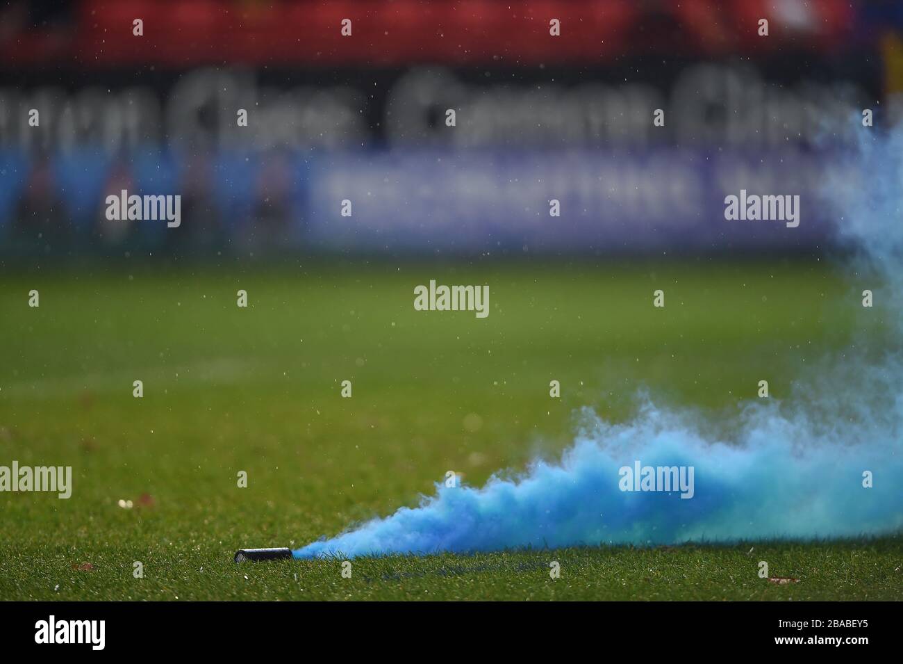 A smoke bomb thrown onto the pitch by the Blackburn Rovers fans Stock