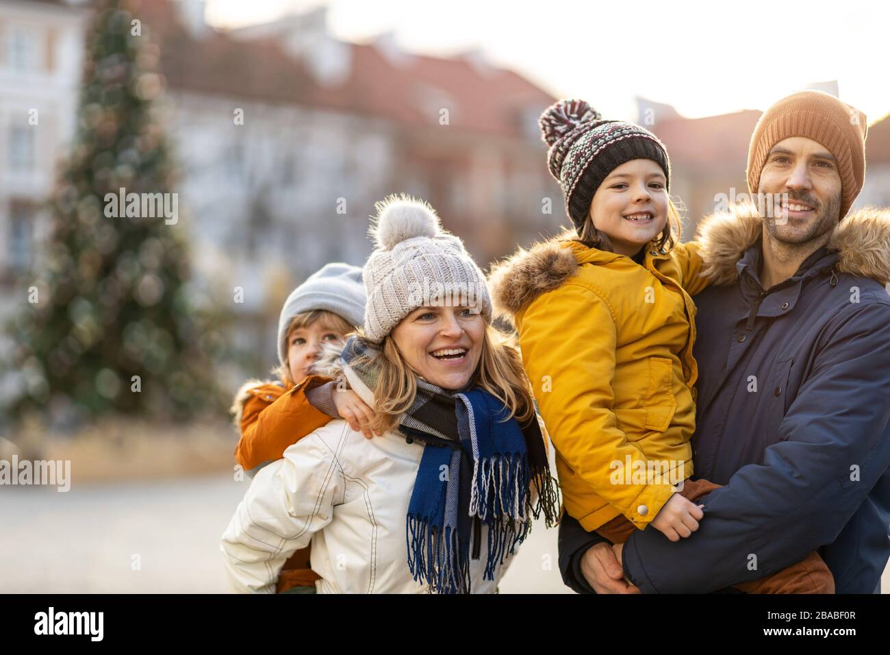 Affectionate young family enjoying their day in a city Stock Photo