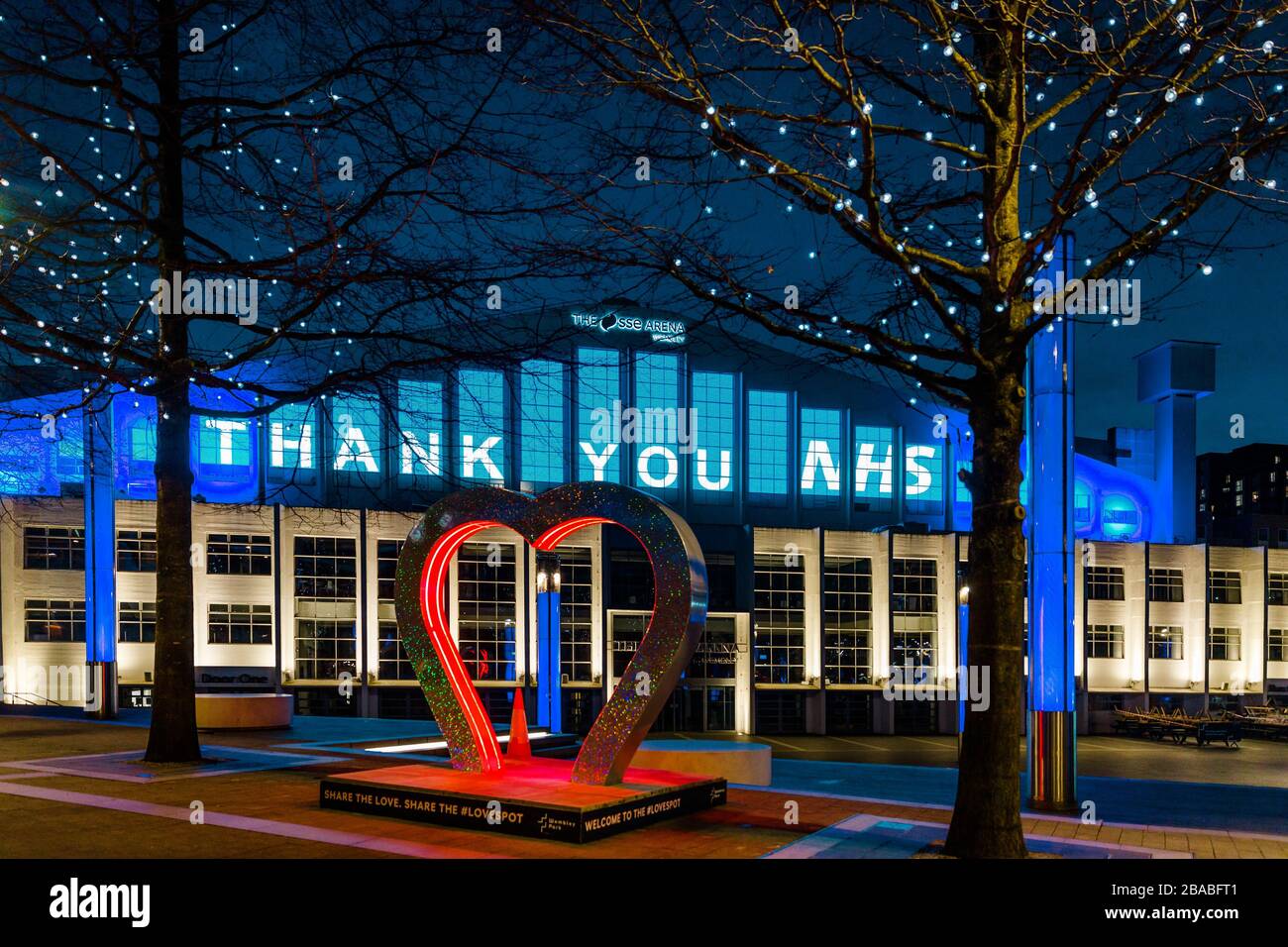 London, UK. 26th Mar, 2020. SSE Arena Wembley is illuminated blue with a 'Thank You NHS' message. At 8pm, People all over the UK took part in a 'Clap for the NHS' to applaud NHS workers for their hard work battling the coronavirus COVID-19 pandemic. Credit: amanda rose/Alamy Live News Stock Photo