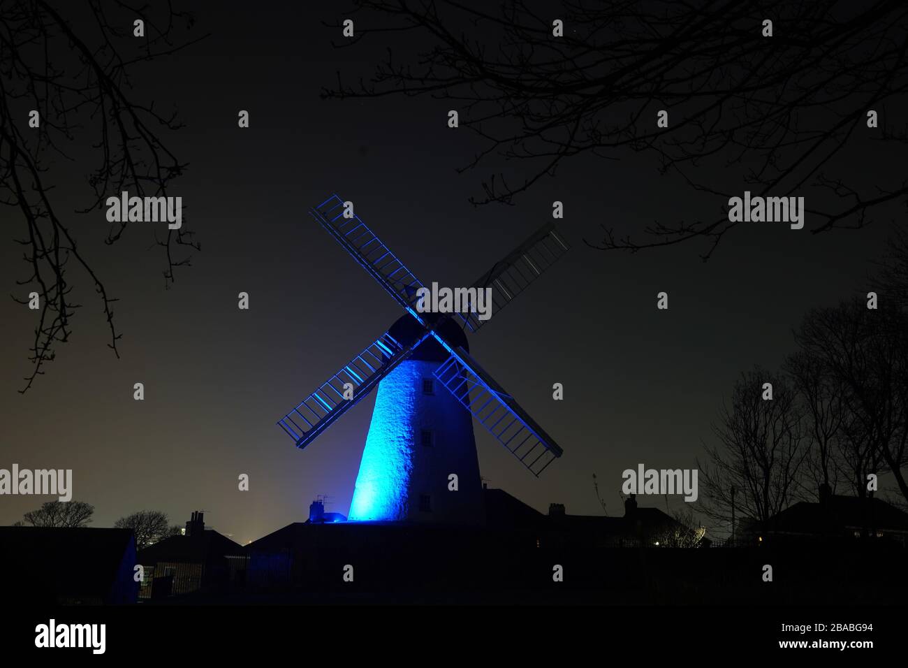 Fulwell Windmill in Sunderland is lit up in blue in a gesture of thanks to the hardworking NHS staff who are trying to battle coronavirus. A national salute for the frontline healthcare heroes is taking place across the UK with a mass round of applause from doorsteps, windows and balconies on Thursday at 8pm. Stock Photo