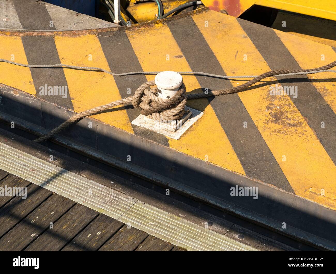 Mooring line and bollard on a work barge Stock Photo Alamy