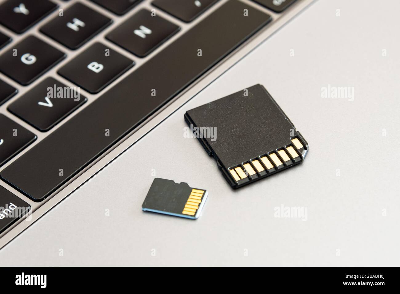 A SD and micro SD memory card on a laptop computer Stock Photo - Alamy