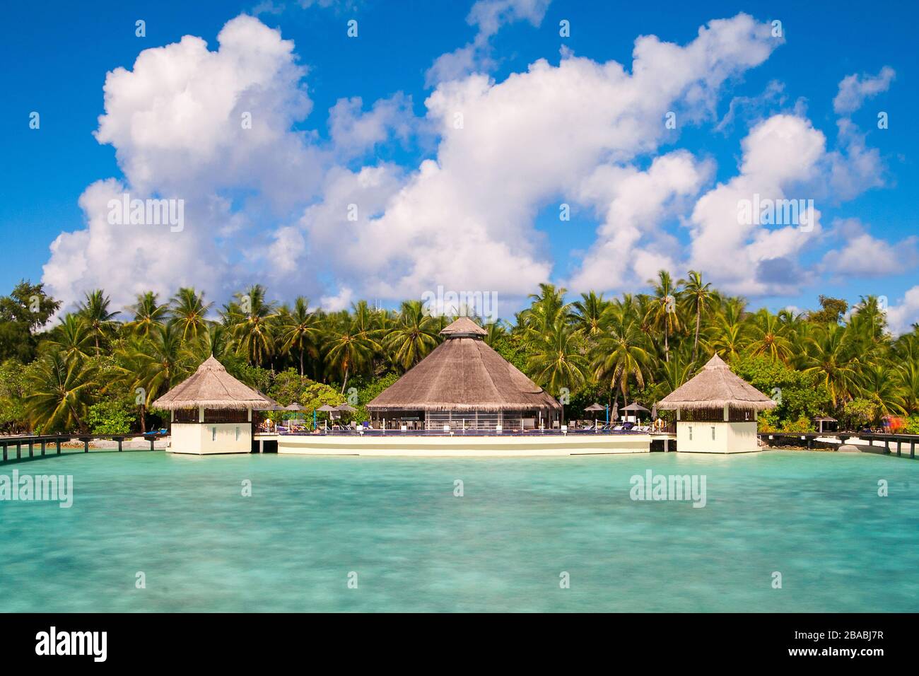 A view at the beach and waterhuts at tropical island, Maldives Stock Photo