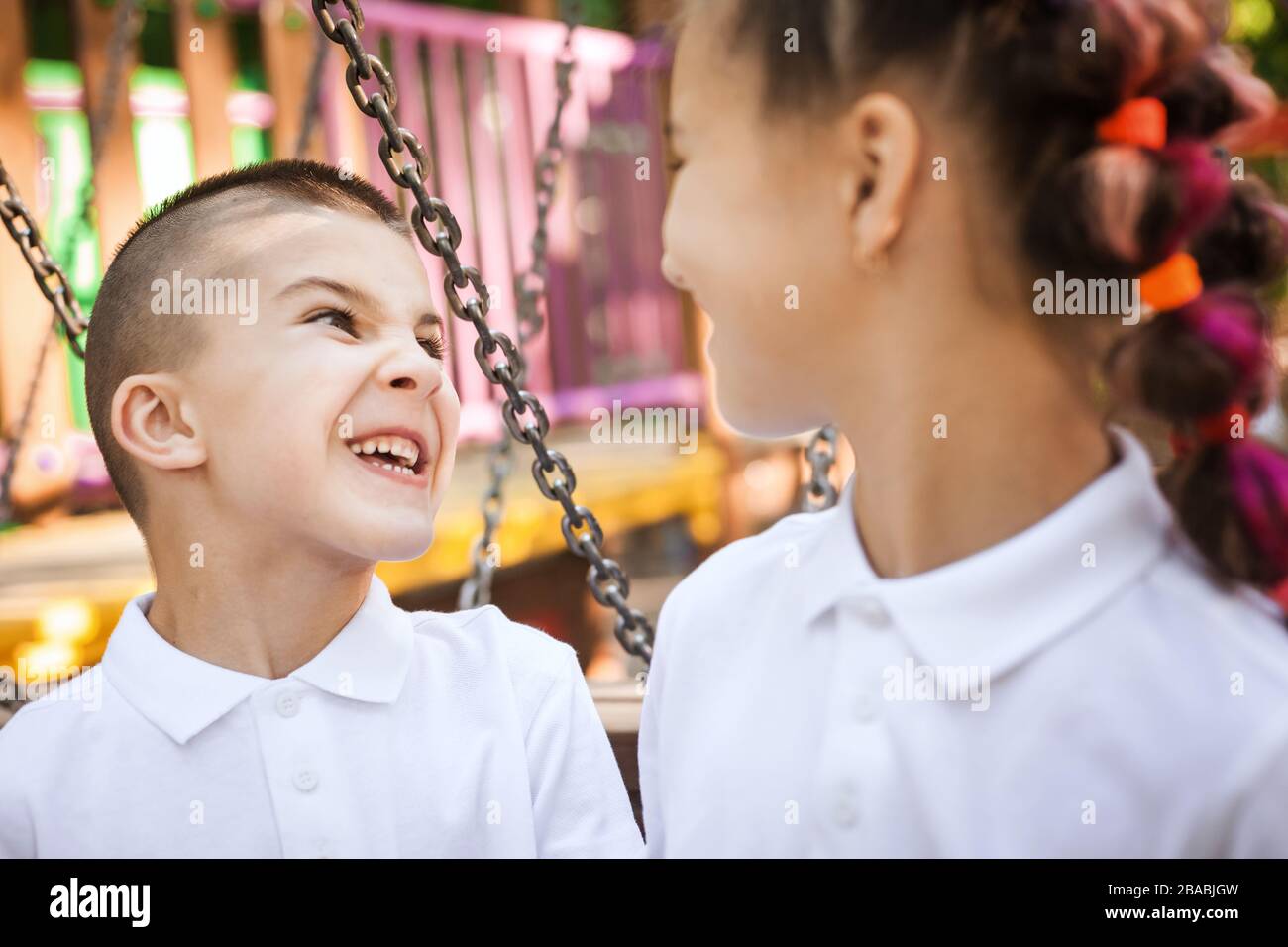 happy boy and girl looking at each other Stock Photo - Alamy
