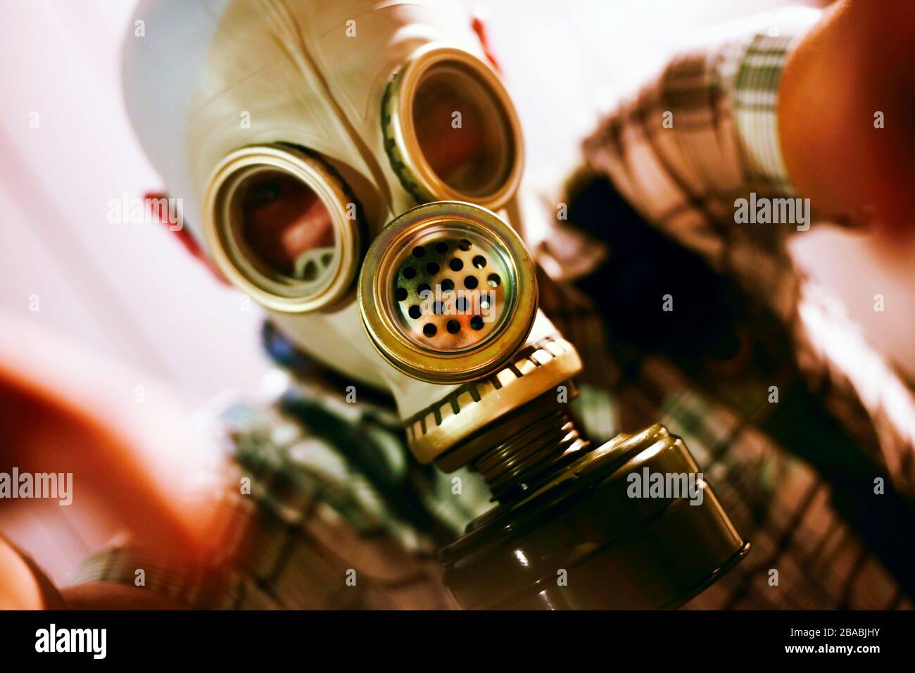 Man in a gas mask on night street Stock Photo