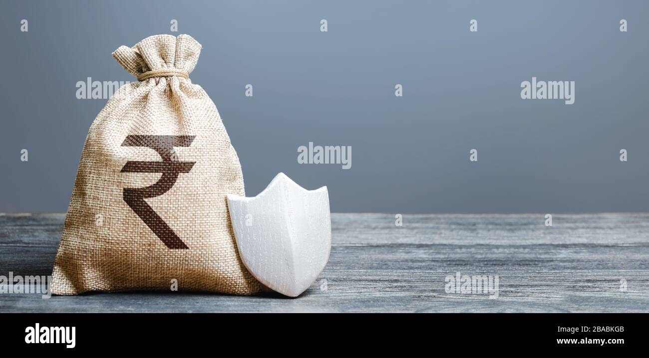 Indian rupee money bag and protection shield. Ease doing business. Attractive lending conditions, rule of law, secure capital. Protection of foreign i Stock Photo