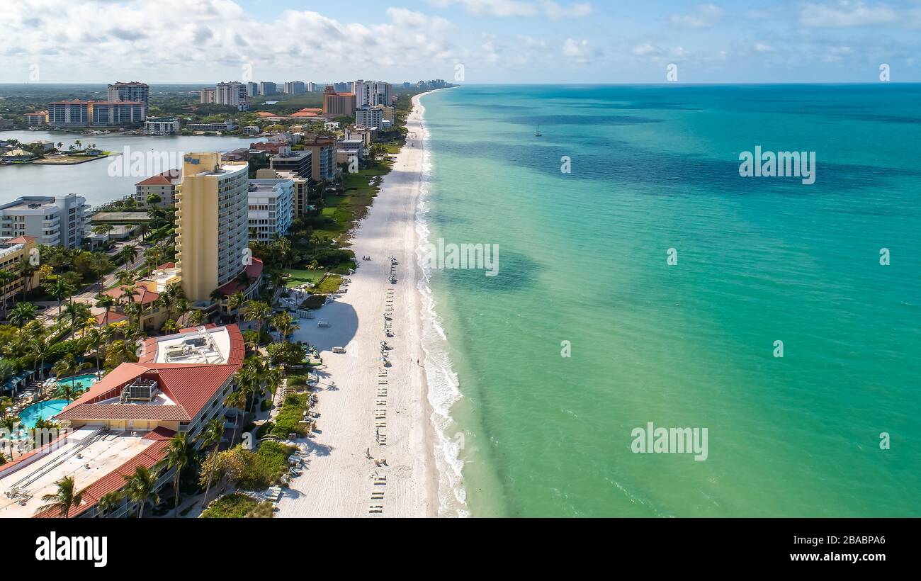 Empty beaches in Naples Florida in the middle of Spring Break and peak season due to Corona Virus Covid - 19. Typically these gulf beaches are full of tourist in the middle of high tourist season. Stock Photo