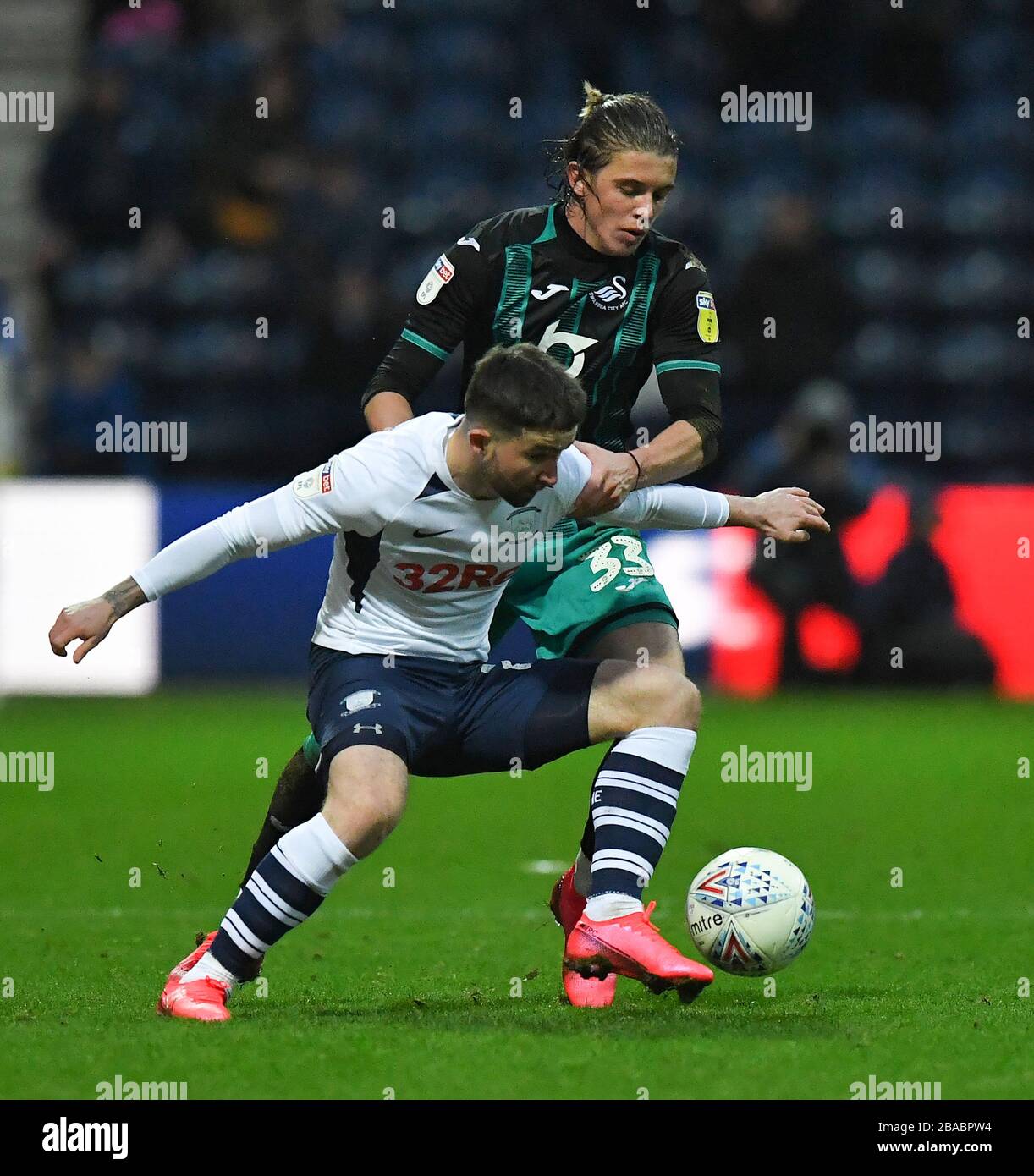 Preston North End's Sean Maguire (left) and Swansea City's Conor Gallagher battle for the ball Stock Photo