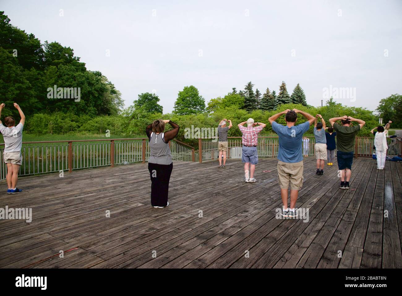 Senior adults exercising in the public park Stock Photo
