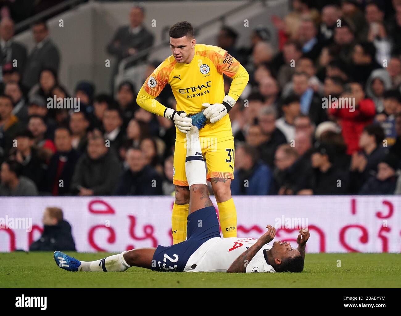 Tottenham Hotspur S Steven Bergwijn Is Treated For Cramp By Manchester City Goalkeeper Ederson During The Premier League Match At The Tottenham Hotspur Stadium London Stock Photo Alamy