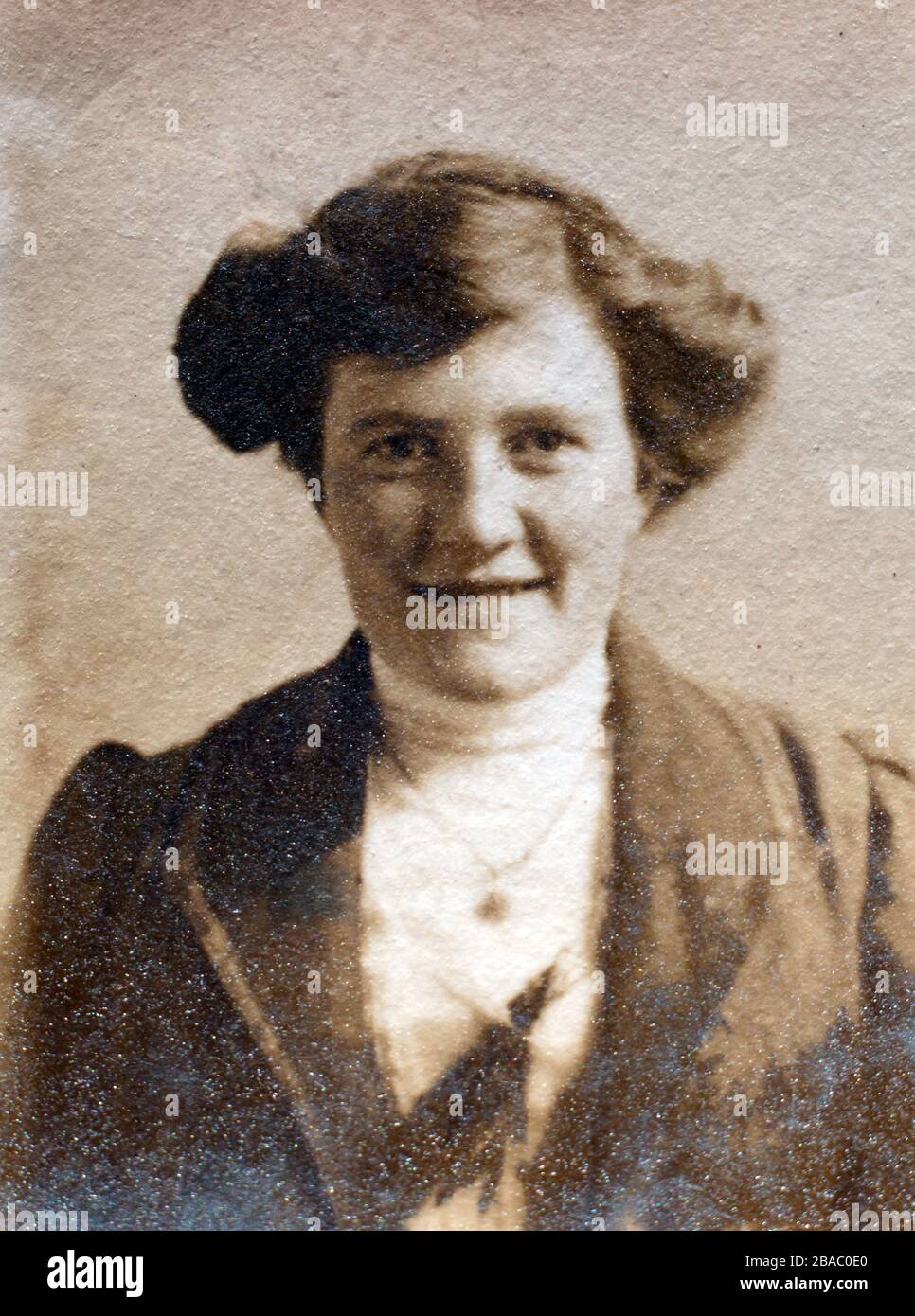 Archive portrait circa 1910 of a young Edwardian woman - printed on textured paper. Stock Photo