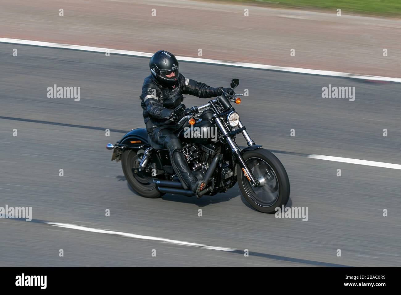 Harley Davidson Motorbike rider;  two wheeled transport, motorcycles, vehicle, motorbikes, bike riders on the M6 motorway Chorley, UK Stock Photo