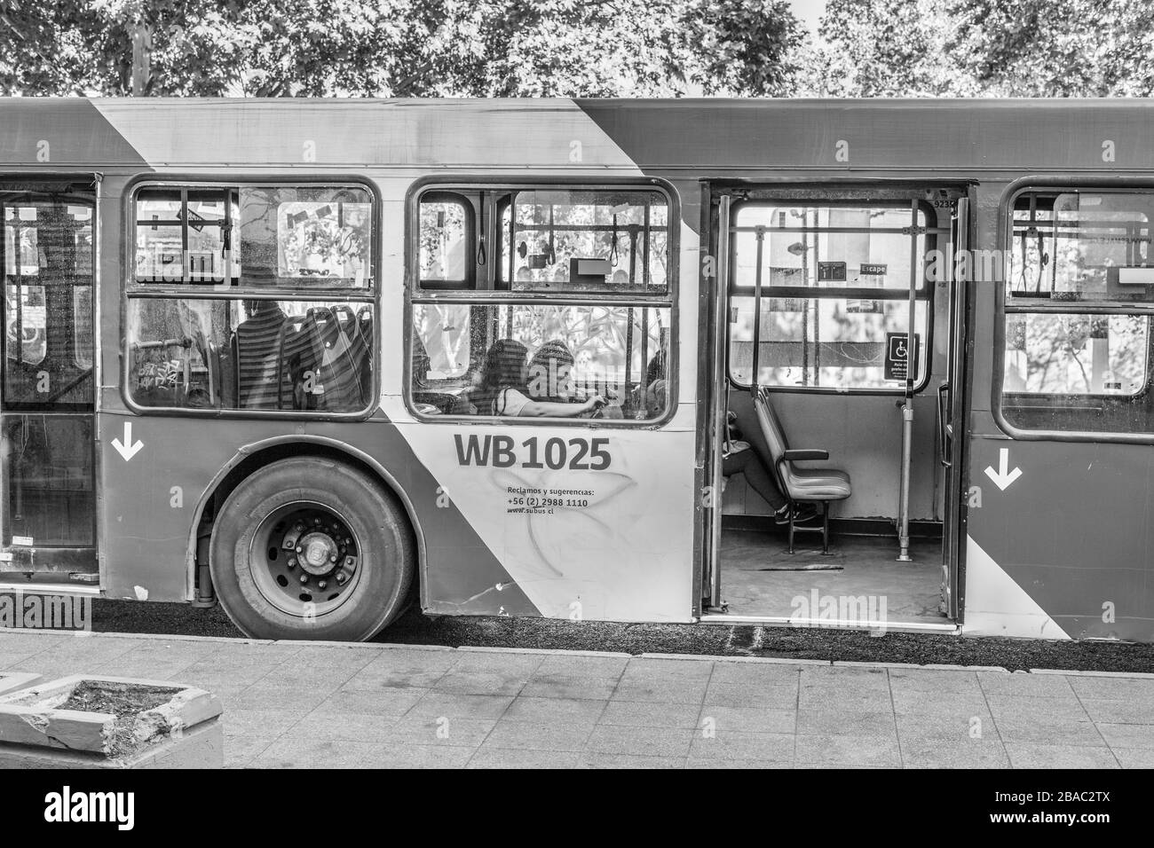 Public transport with empty buses at Providencia streets during the last hours before the COVID-19 Coronavirus lockdown Santiago, Chile, 26.03.2020 Stock Photo