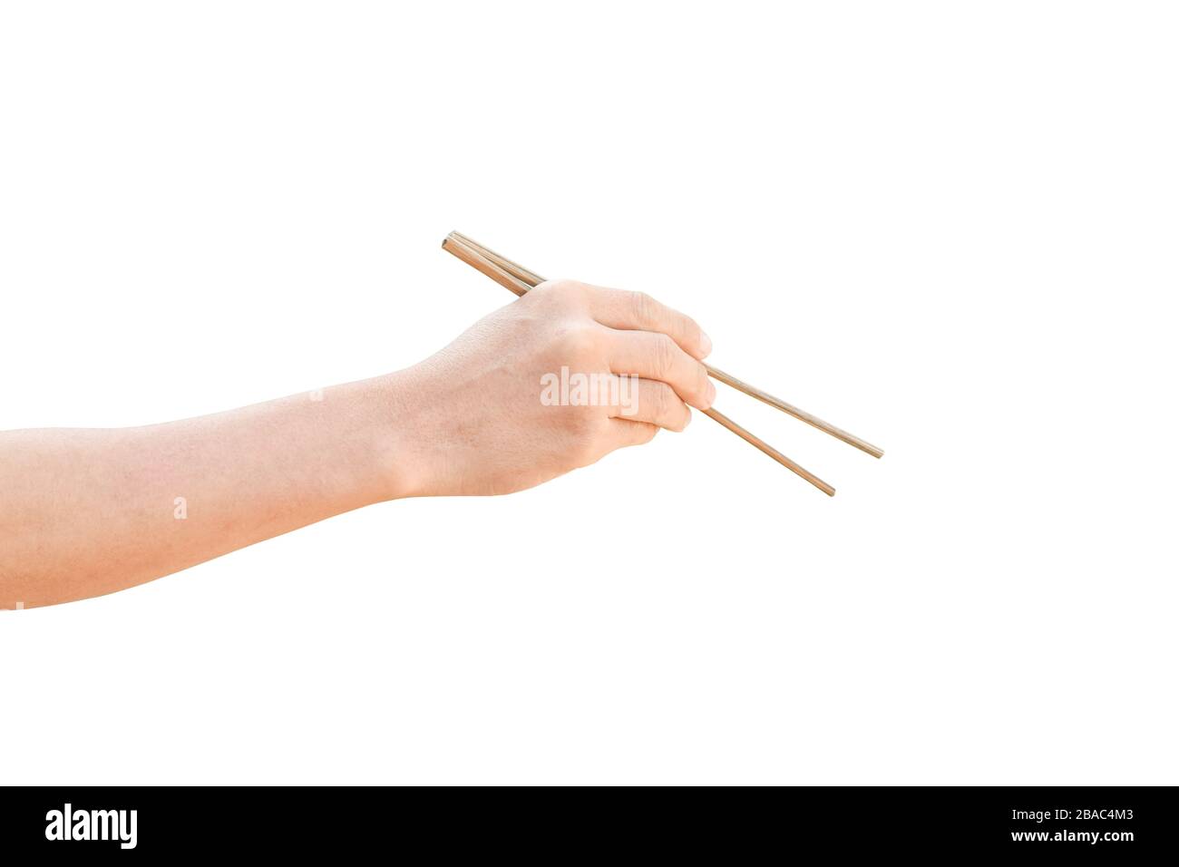 hand holding wooden chopsticks isolated on white background with clipping path. Stock Photo