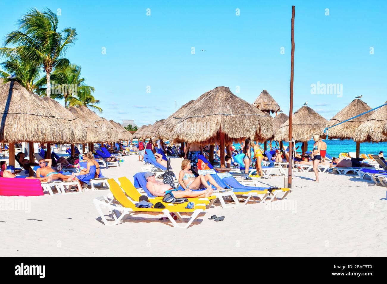 Riviera Maya, Mexico - Dec. 22, 2019: Beachgoers flock to the tropical beaches of Riviera Maya near Cancun, Mexico, during the popular Winter getaway Stock Photo