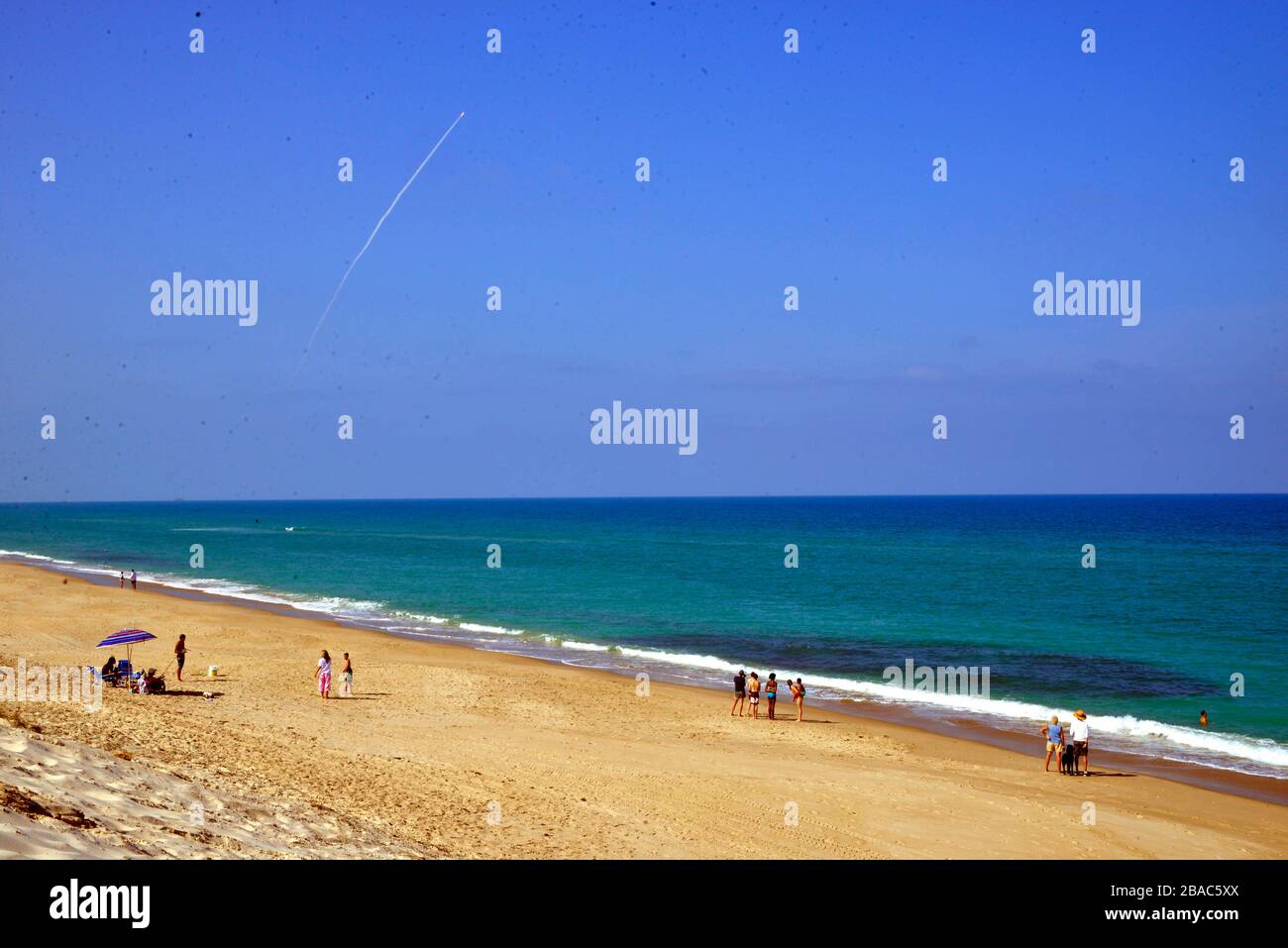 Melbourne Beach. Florida. USA. March 26, 2020. Thirty Miles south of the  launch complex at Cape Canaveral Space Port Station an Atlas V launch of  AEHF-6, the first National Security mission for