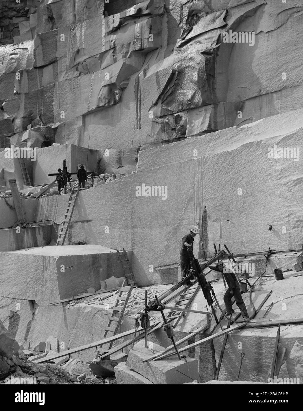Channeling Machine Stone Men working in a New Hampshire granite quarry, c. 1908. Miners are ...