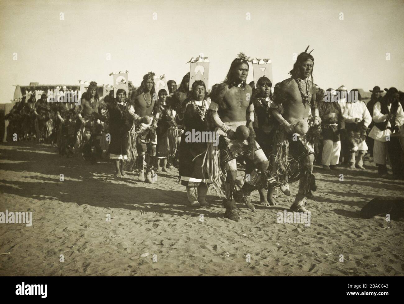Costumed Jemez Pueblo Indians perform a ceremonial dance, possibly on