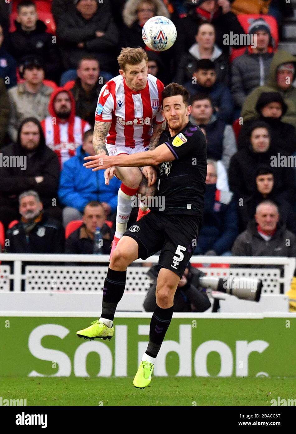 Charlton Athletic's Tom Lockyer and Stoke City's James McClean compete for a header Stock Photo