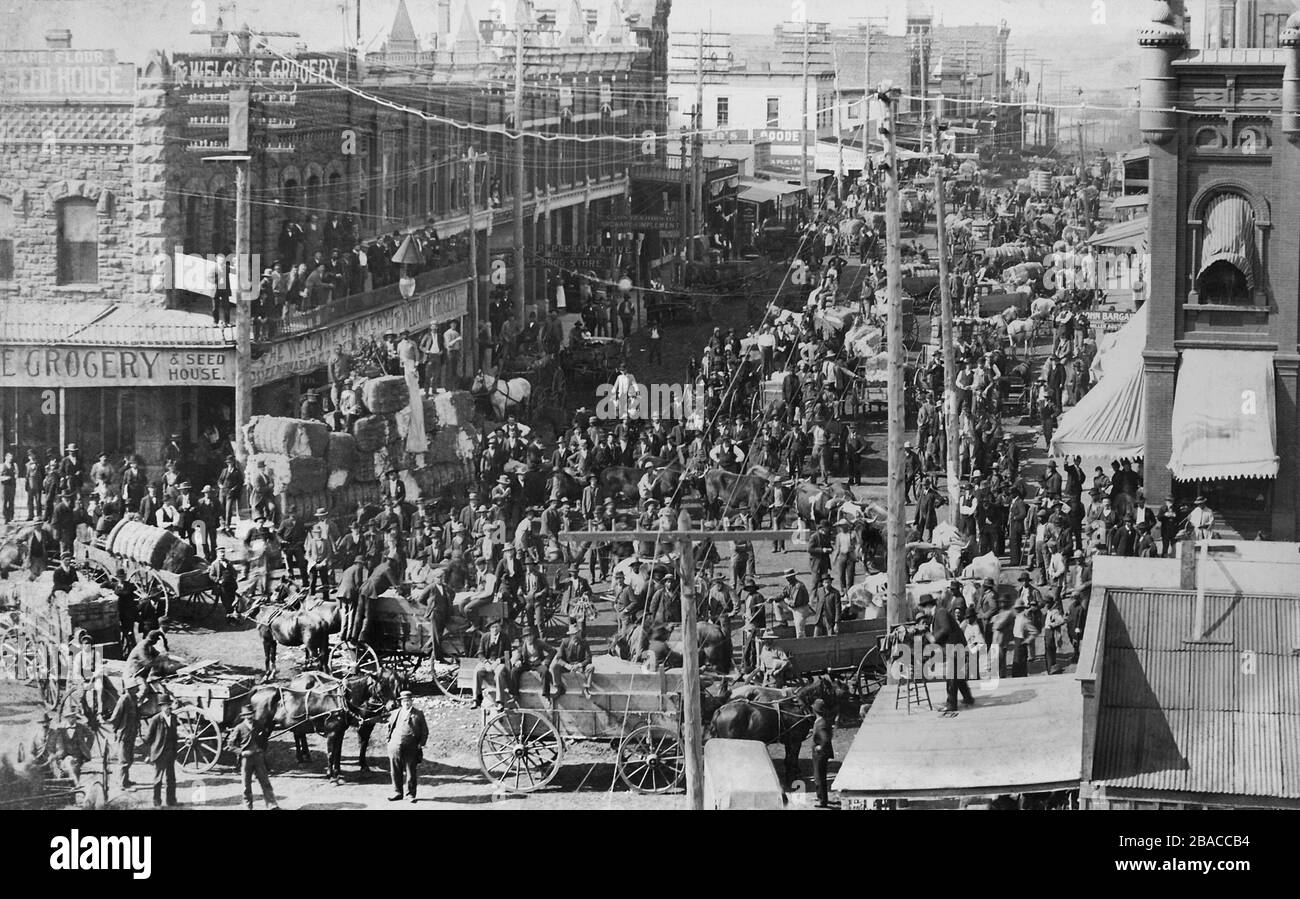 The streets of Gurthrie, Oklahoma, are crowed with wagons of bailed