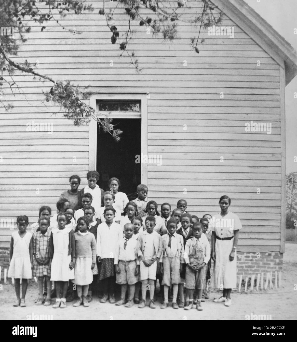 Twentysix African American students in a group portrait with their teacher, at a Hurlock