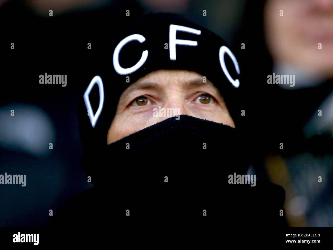 A Derby County fan in the stands during the match Stock Photo