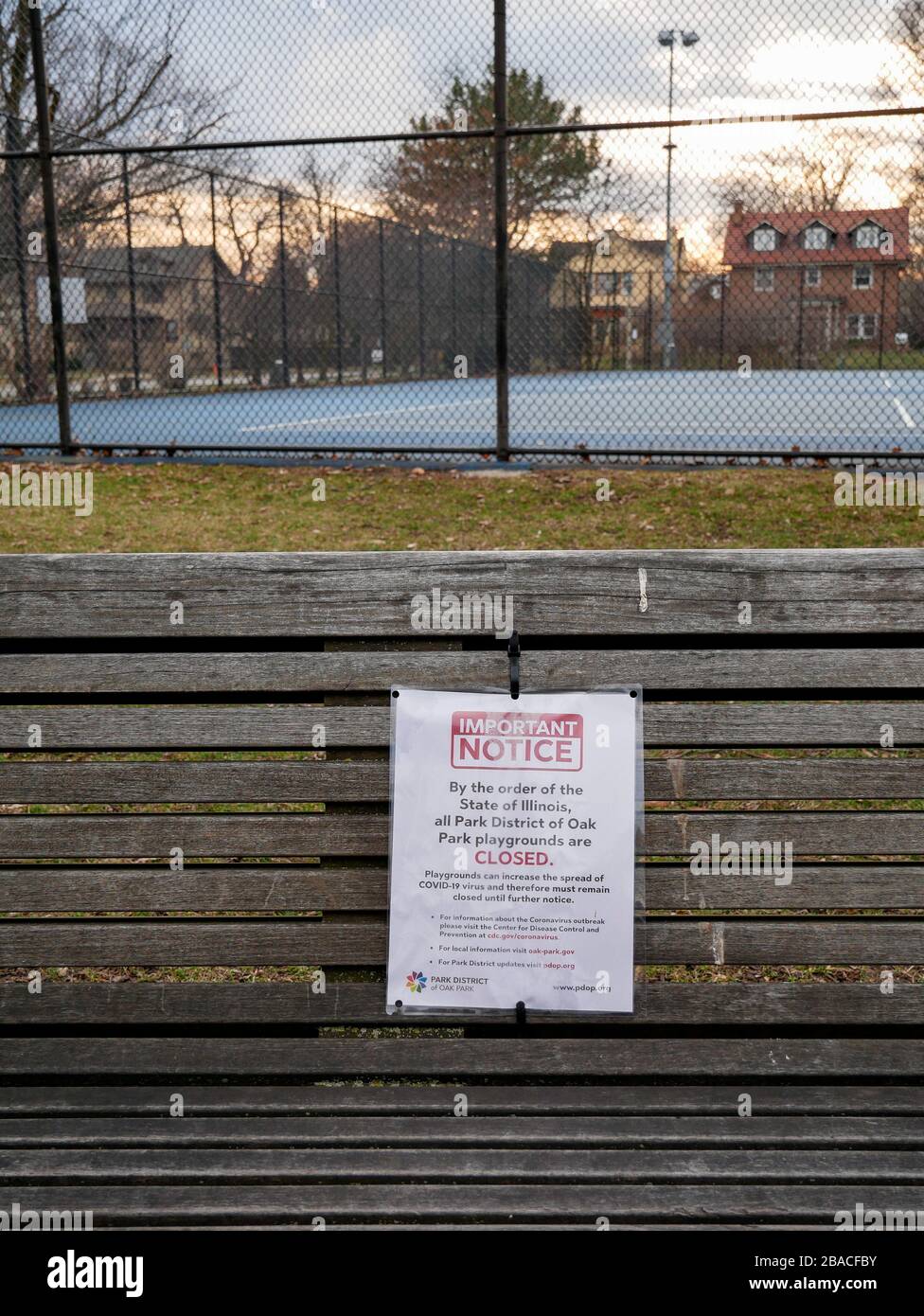 Oak Park, Illinois, USA. 25th March, 2020. Playground closed due to COVID-19 notice in Taylor Park. The closure includes tennis and other outdoor sports faciilities. Stock Photo