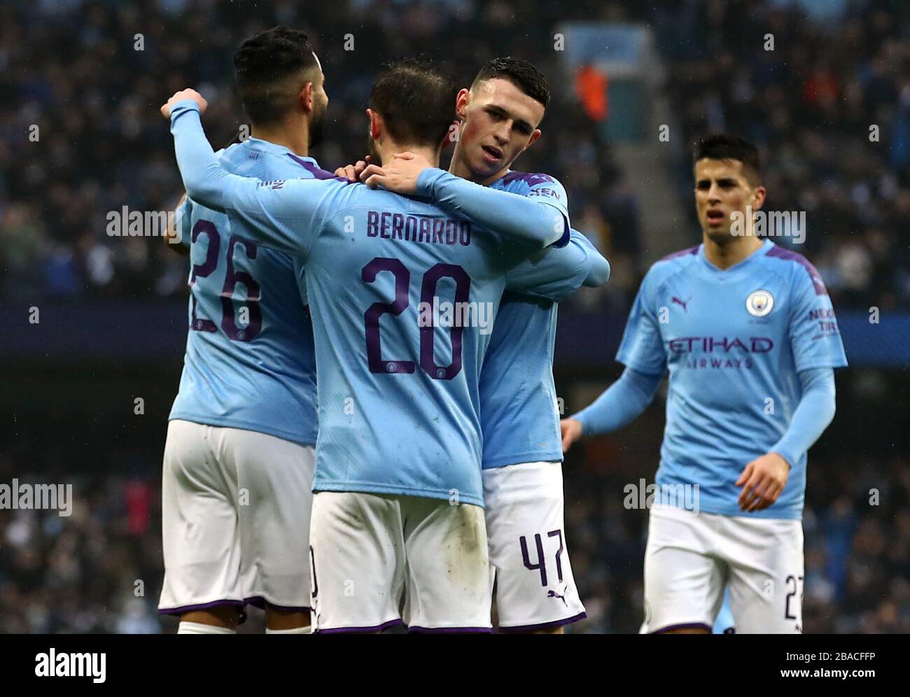 Manchester City's Bernardo Silva (centre) celebrates scoring his side's second goal of the game with team-mates Riyad Mahrez (left) and Phil Foden Stock Photo