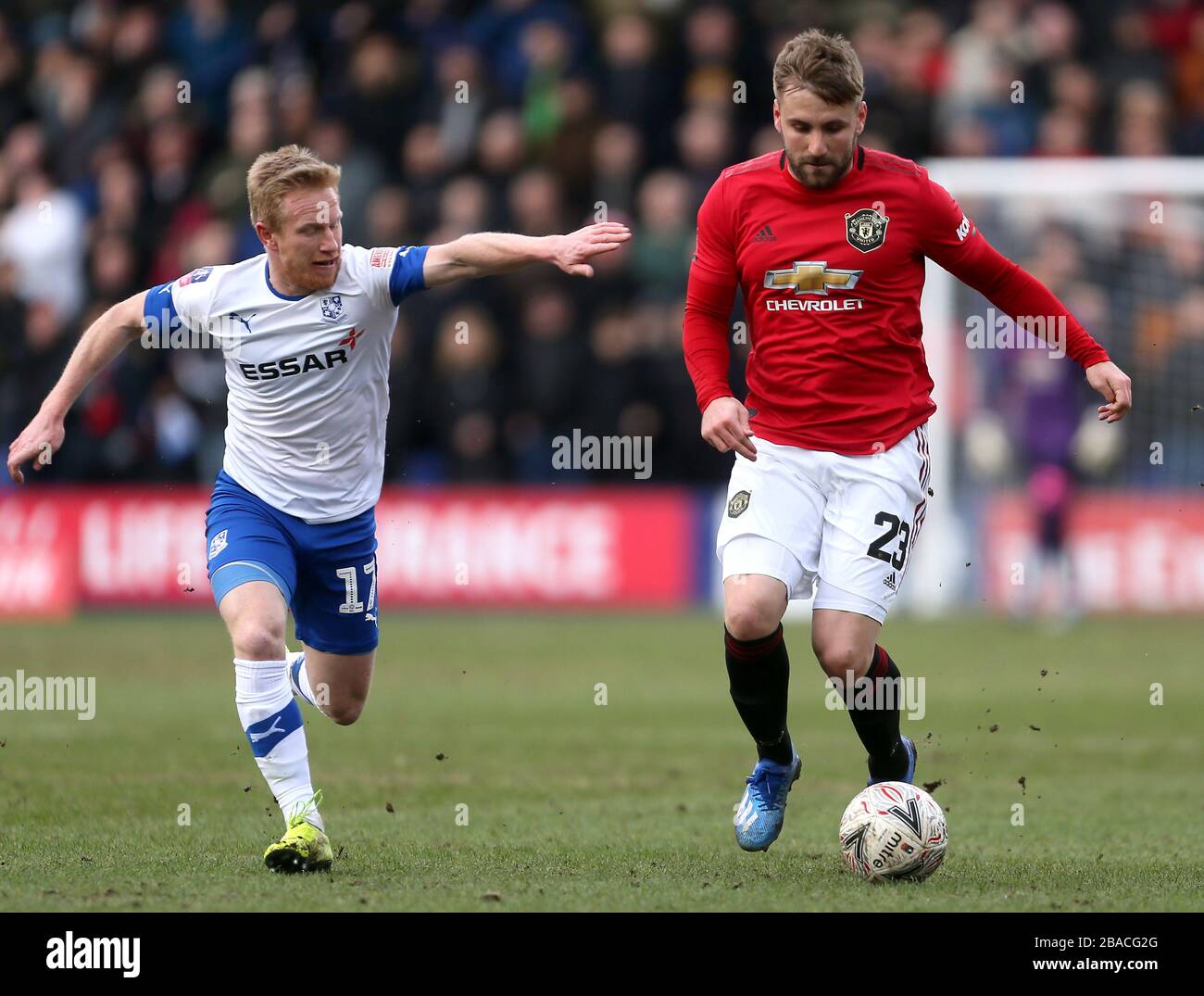 Tranmere Rovers' David Perkins (left) and Manchester United's Luke Shaw battle for the ball Stock Photo