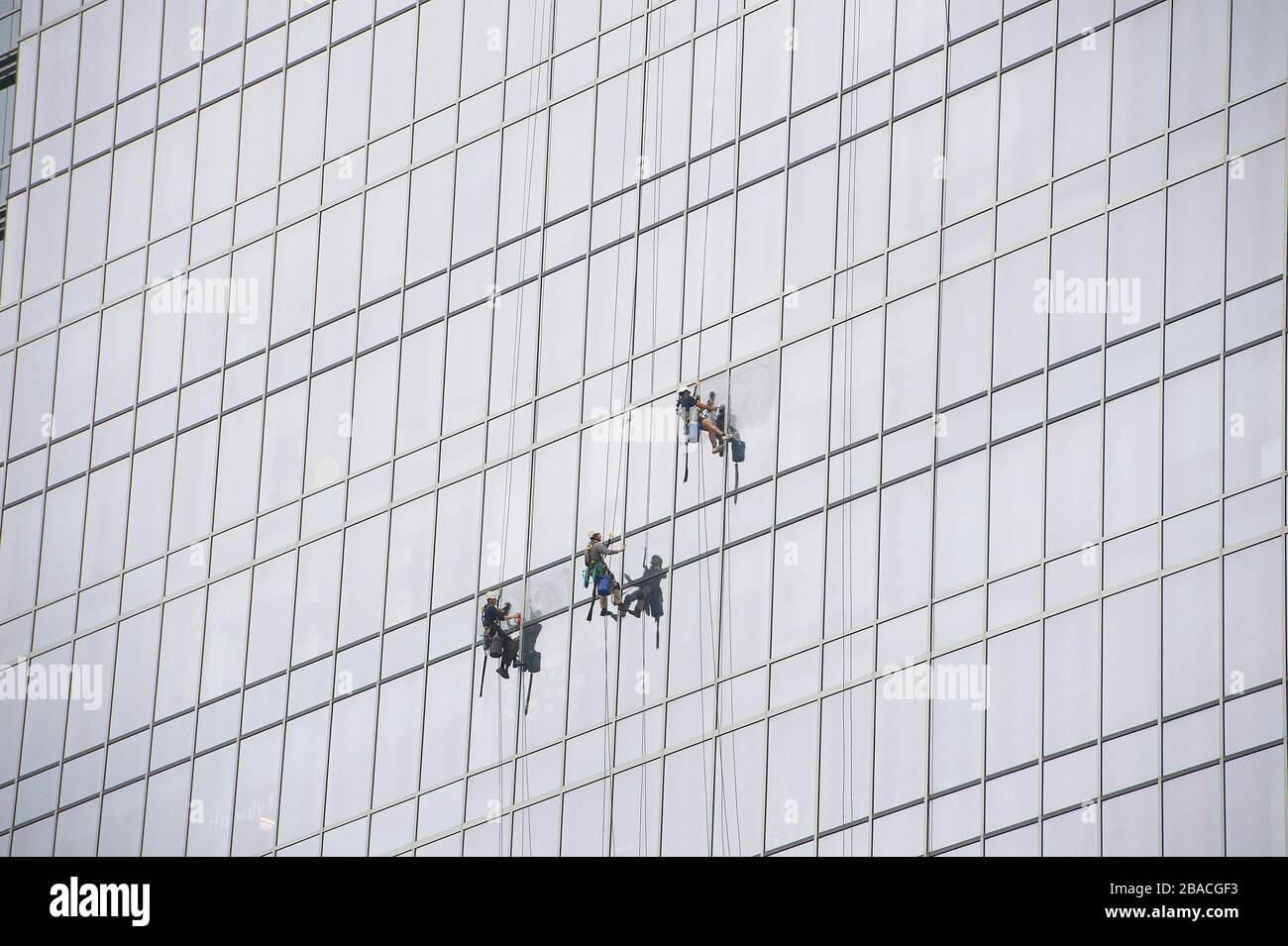 Downtown Austin, Texas, USA. 26th Mar, 2020. The world wide Pandemic Covid-19 impacted the daily workforce worldwide, A team of window washers working together to clean windows on a building in Downtown Austin, Texas. Mario Cantu/CSM/Alamy Live News Stock Photo
