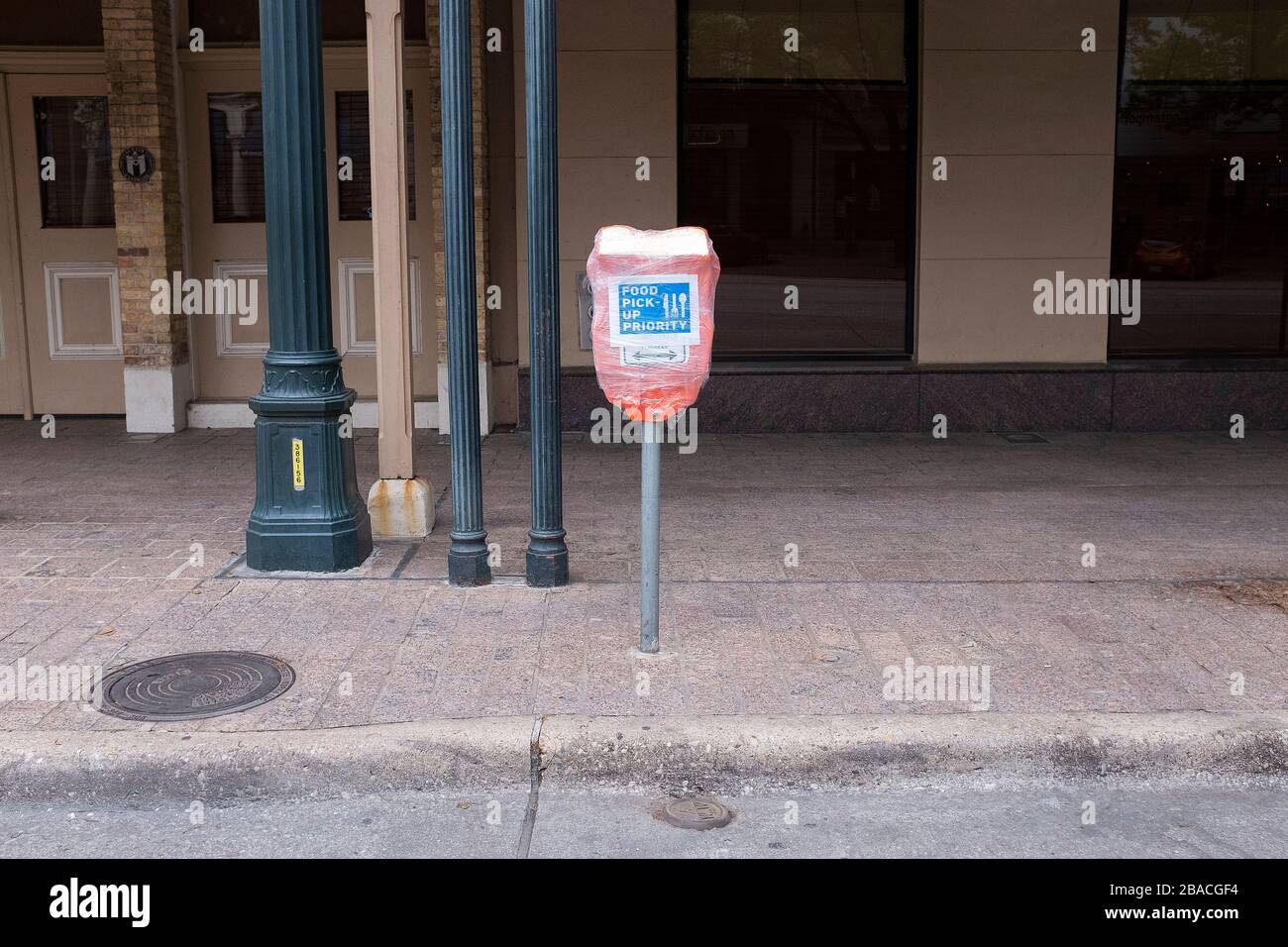 Downtown Austin. 26th Mar, 2020. The world wide Pandemic Covid-19 impacts a parking meter where citizens would normally park in Downtown Austin. The parking meter area has been designated for food pick up priority. Austin, Texas. Mario Cantu/CSM/Alamy Live News Stock Photo