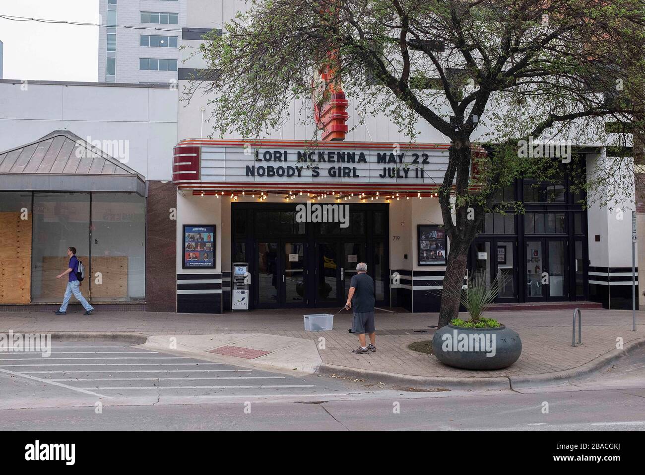March 26, 2020: The world wide Pandemic Covid-19 impacts business at the Stateside Theatre in Austin, Texas. An employee updates future events that could be coming soon to the Stateside Theatre. Mario Cantu/CSM Stock Photo
